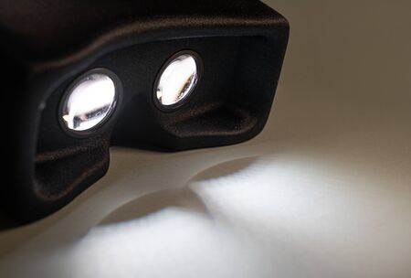 Virtual reality device on, casting light shadowsの写真素材