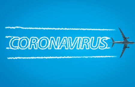Airplane leaving jet contrails with coronavirus word insideの写真素材
