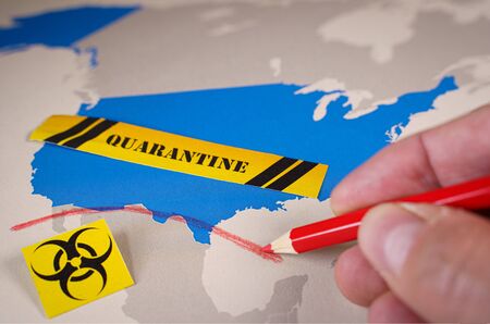 Hand drawing a red line between USA and Mexico countries, Coronavirus concept.の写真素材