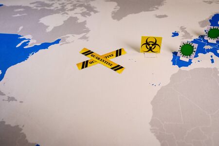 world map with quarantine cross between USA and Europeの写真素材