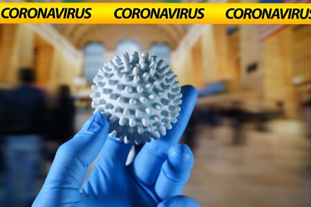 Coronavirus ball with NYC Grand central on the backgroundの写真素材