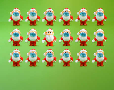 Santa Claus without face mask standing out from the crowdの写真素材