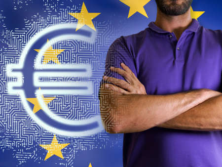 A man Young man with arms crossed against Digital euro and EU flagの写真素材