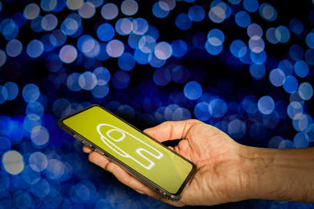 Smartphone with popular game app. Among us conceptの写真素材