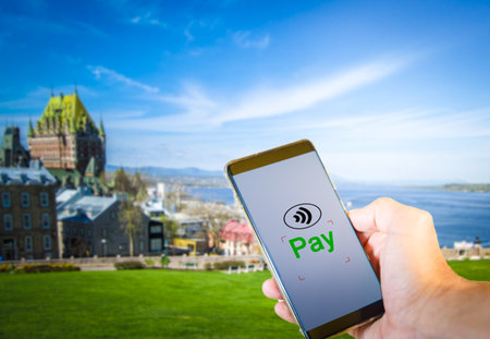 Man paying using smartphone, cashless payment technology conceptの写真素材