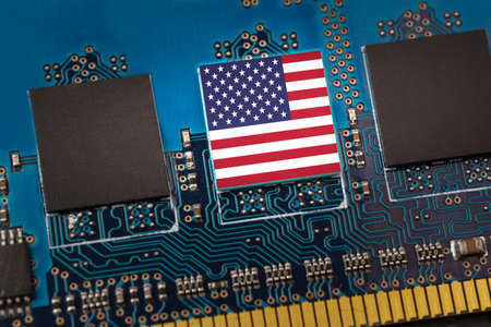Flag of USA in the center of a circuit boardの写真素材