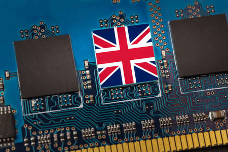 Flag of the UK in the center of a circuit boardの写真素材