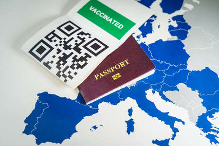 Digital green passport with QR code over an EU mapの写真素材