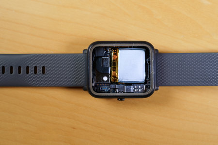 Disassembled smartwatch showing the interior, battery, different sensors and CPU.の写真素材