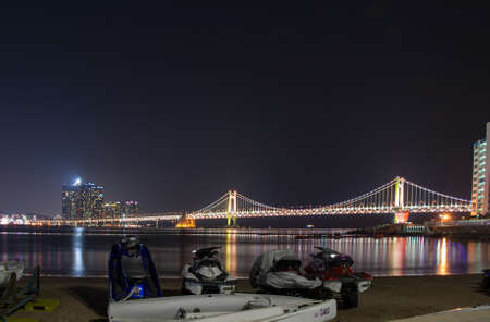 Busan, South Korea. October 2012: GwangAn Bridge at night in Busan with reflectionのeditorial素材
