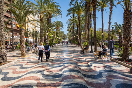Alicante, Spain. March 2016: People walking and resting in Paseo de la Explanada in Alicante.のeditorial素材