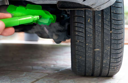hand painting a car exhaust pipe greenの写真素材