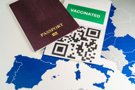 Vaccination with QR code and a Passport over an EU mapの写真素材