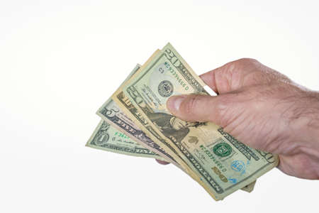 Hand giving or paying money, US dollar billsの写真素材