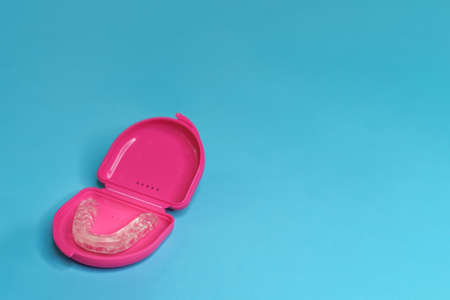 dental retainer teeth in a pink boxsetの写真素材