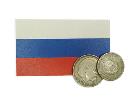 Commemorative USSR or CCCP 1 ruble Lenin coin over a Russian federation flagの写真素材