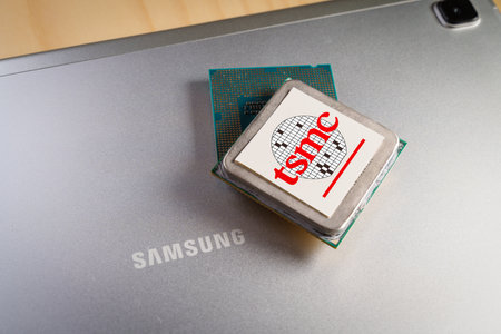 Barcelona, Spain. November 28, 2022: Microchips with the TSMC logo on top of a Samsung-branded...
