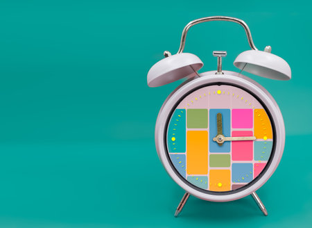 Ringing twin bell vintage classic alarm clock Isolated on blueand with the time blocking concept