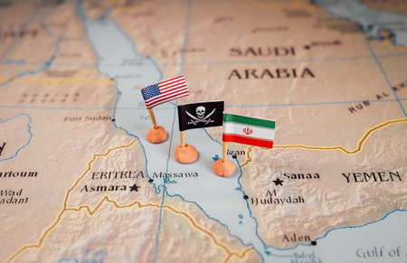 Flags of USA and Iran surrounding the skull and crossbones pirate flag. The Red Sea Conflict Conceptの写真素材