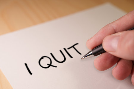 Hand Writing a resignation letter with the I QUIT. Great resignation conceptの写真素材