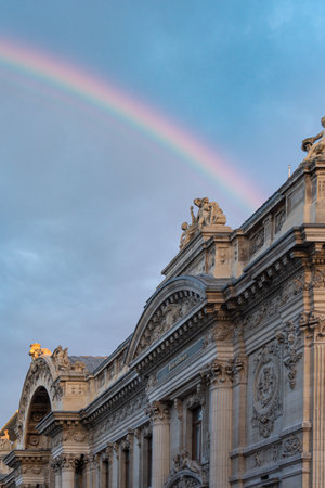 Palace of the Stock Exchange in Brussels with a rainbow in the backgroundのeditorial素材