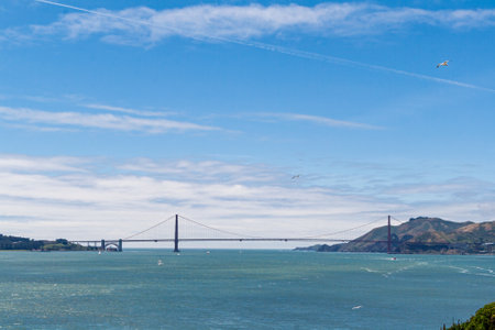 Golden gate bridge dominating san francisco bay on sunny day