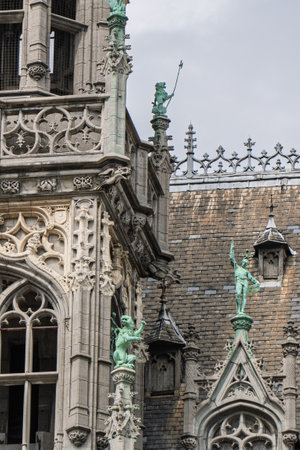 Brussels grand place architecture showing statues and ornate detailsの写真素材