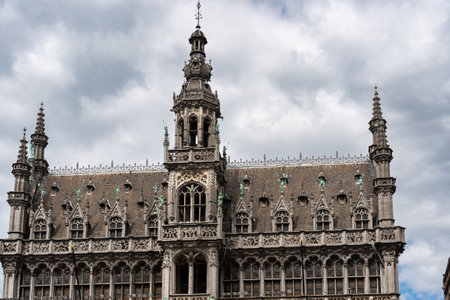 Brussels grand place majestic architecture under cloudy skyの写真素材