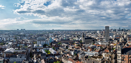 Brussels skyline showing saint catherine church under cloudy skyの写真素材