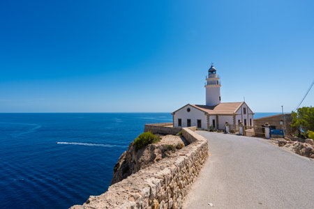 Capdepera lighthouse overlooking the mediterranean sea in mallorca, spainの写真素材