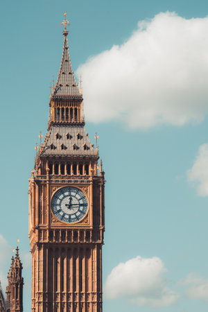 Big ben clock tower standing tall in london, uk on sunny day
