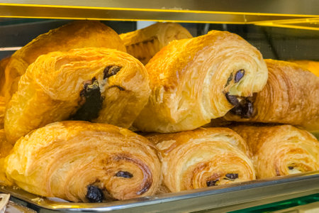 Freshly baked pain au chocolat showcasing irresistible chocolate filling in a Parisian boulangerie