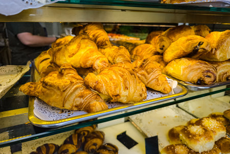 Freshly baked golden croissants tempting customers in a Parisian bakery display
