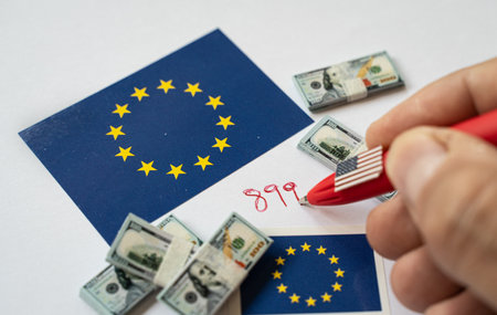 Hand writing 899 act regulation number near European union and USA flag with dollar banknotes