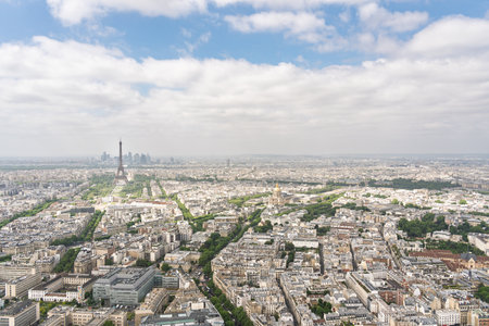 Paris cityscape featuring Eiffel Tower under cloudy skyの写真素材