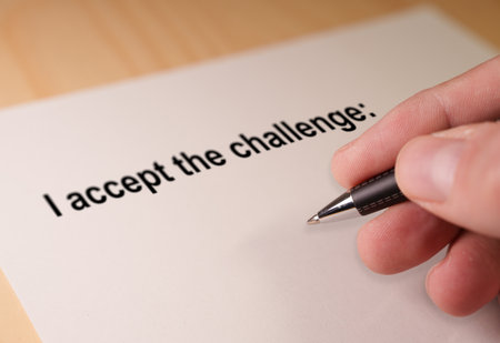 Hand accepting challenge, signing commitment for future goalの写真素材