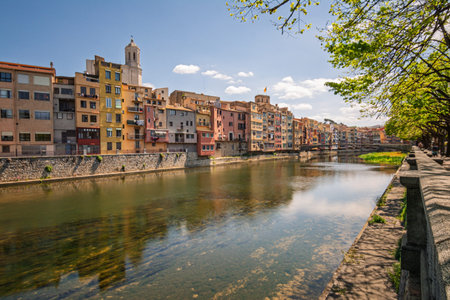 Girona colorful houses reflecting on Onyar River