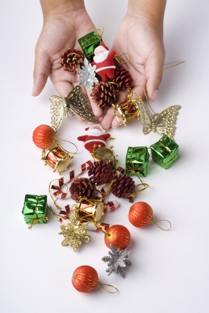 Yong boy holding the Christmas decoration in hands.の写真素材