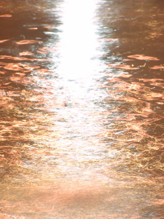 light shines to affect the water sparkles gold colorの写真素材