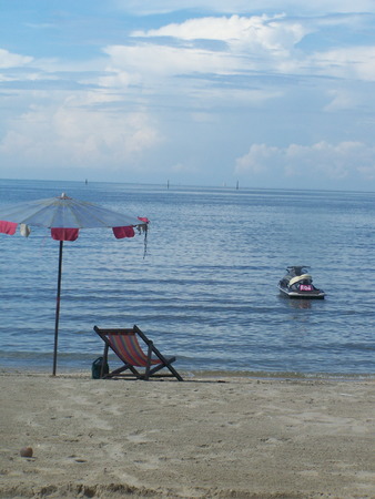 umbrella and a chair on the seaside  a beach is bangsan , tourist highly popular attraction is of Thailandのeditorial素材