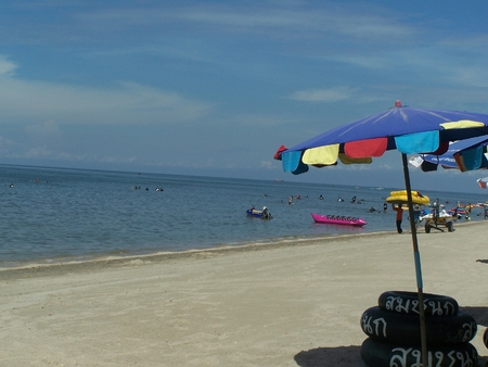 umbrella and a chair on the seaside a beach is bangsan , tourist highly popular attraction is of Thailandのeditorial素材