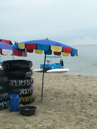 umbrella and a chair on the seaside a beach is bangsan , tourist highly popular attraction is of Thailandのeditorial素材