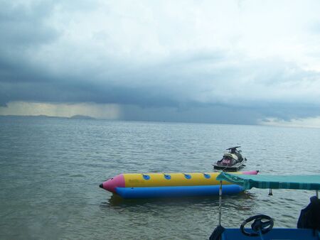 it rains the storm starts middle the sea and move to meet the shore where a beach bangsan thai landのeditorial素材