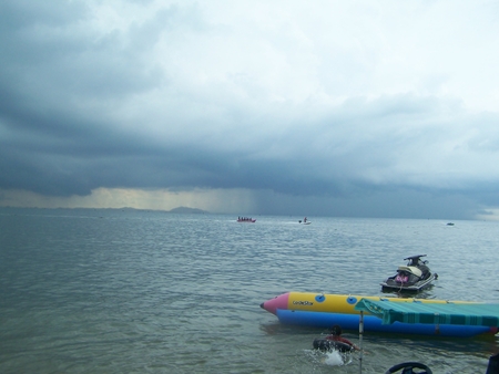 it rains the storm starts middle the sea and move to meet the shore where a beach bangsan thai landのeditorial素材