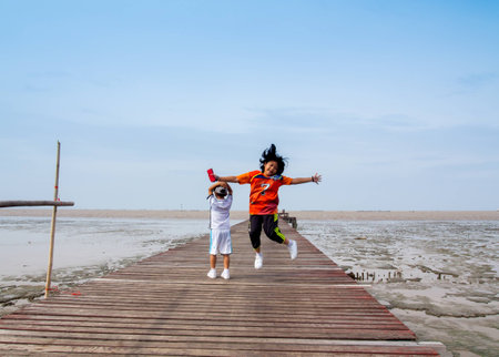 August 5, 2017 at 09.20 am by the sea, fishing pier, fishing, Bangpoo resort,
Children and adults in the community are walking and exercising to watch the sunrise.の写真素材