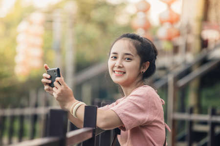 Young beautiful female traveler at the airport traveling.