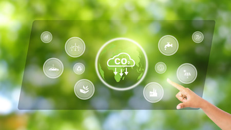 Hand holding to analyze Co2, CO2 environmental social governance investment business concept. Co2 icons pop up on the computer screen in business investment strategy concept.の写真素材