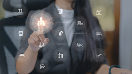 Woman pressing shopping cart icon on the virtual screen. Online shopping concept.の写真素材