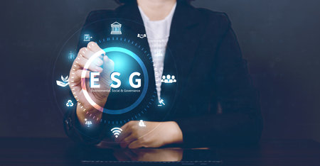 ESG environmental social governance business strategy investing concept. Businesswoman pressing button on screen.の写真素材