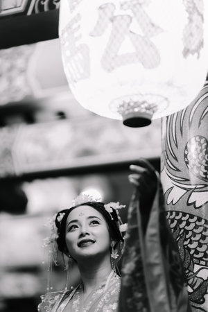 Woman dress China New year. portrait of a woman. person in traditional costume. woman in traditional costume. Beautiful young woman in a bright red dress and a crown of Chinese Queen posing.の写真素材